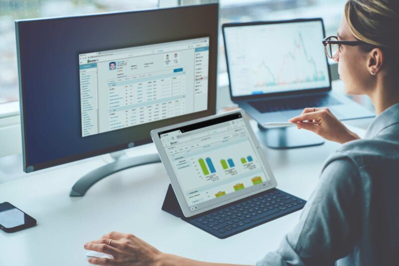 Woman Viewing Shartec Dashboard on Computer